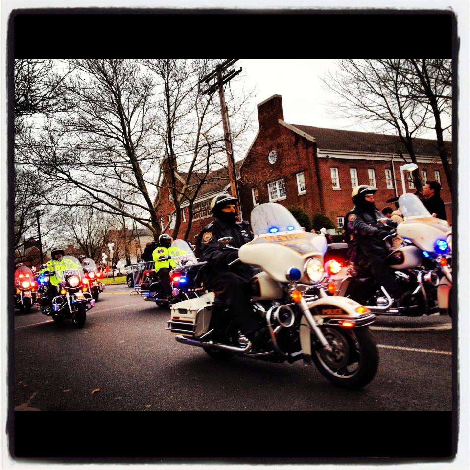 A motorcade leaves the funeral of 6-year-old Newtown shooting victim Noah Pozner.