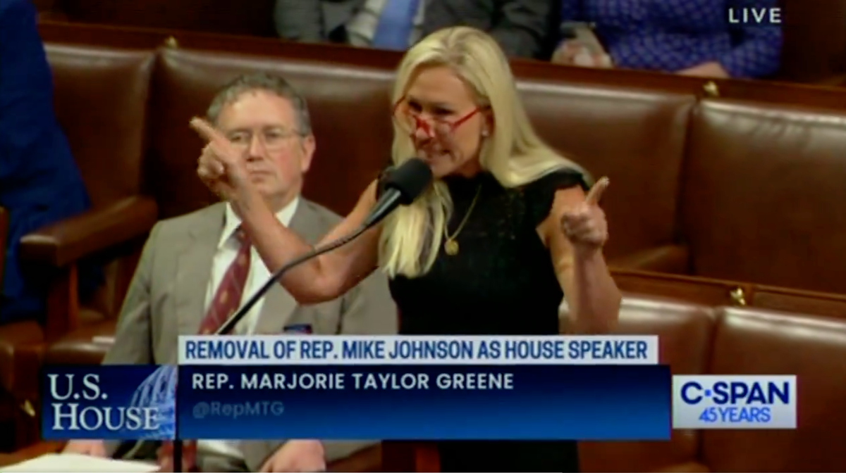 Marjorie Taylor Greene, pictured speaking on the House floor on Wednesday, was defeated when she attempted to remove Speaker Mike Johnson (C-SPAN)