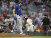 Toronto Blue Jays pitcher Robbie Ray, left, waits for Atlanta Braves' Ronald Acuna Jr. to run the bases after giving up a home run to Acuna in the third inning of a baseball game Tuesday, May 11, 2021, in Atlanta. (AP Photo/Ben Margot)