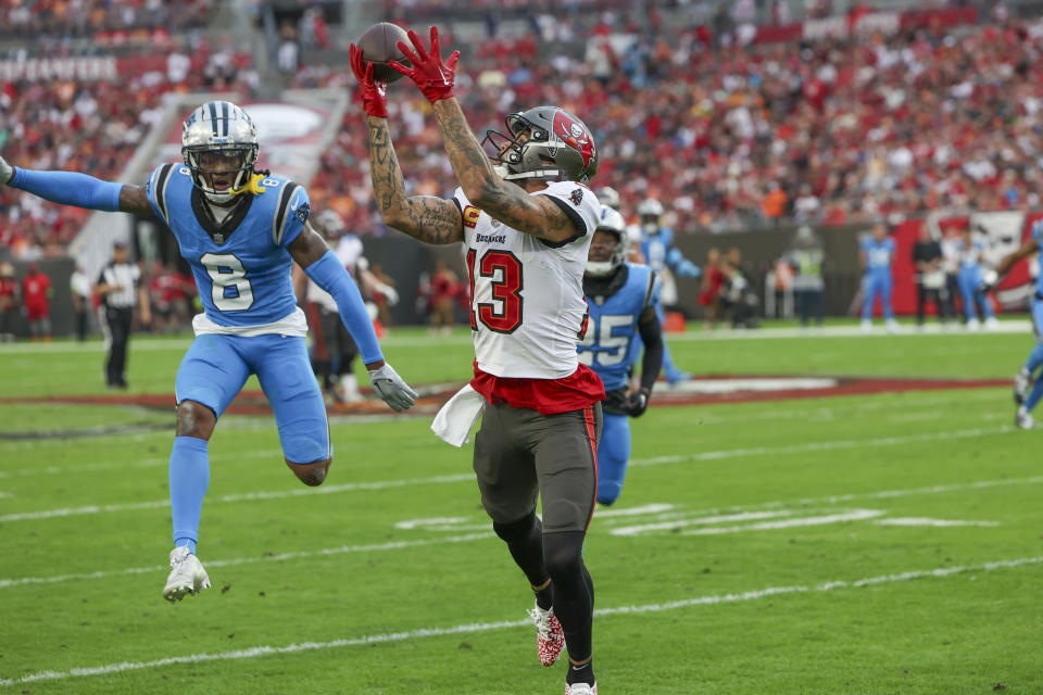 Tampa Bay Buccaneers wide receiver Mike Evans catches a pass against the Carolina Panthers during the first half of an NFL football game Sunday, Dec. 3, 2023, in Tampa, Fla. (AP Photo/Mark LoMoglio)