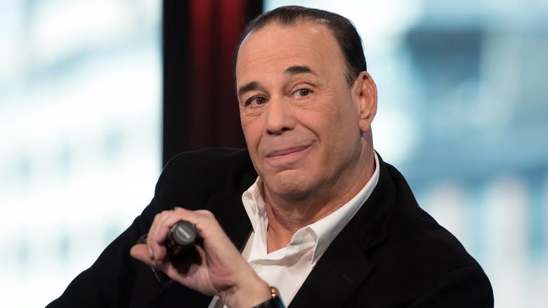 Jon Taffer holding a microphone