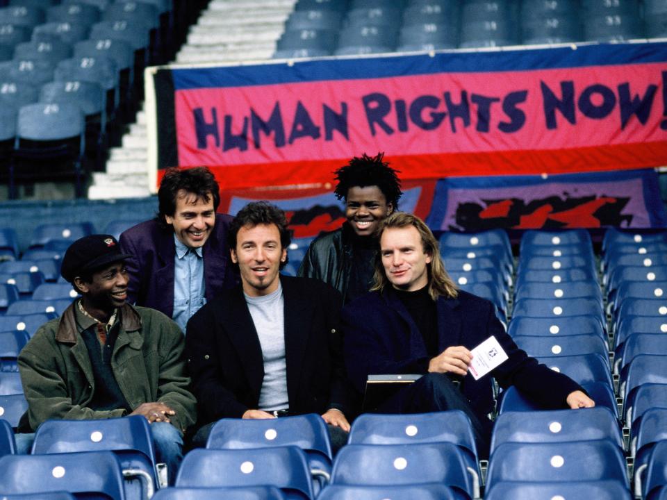 Youssou N'Dour, Peter Gabriel, Bruce Springsteen, Tracy Chapman and Sting pose prior to the 'Human Rights Now!' concert, in aid of Amnesty International, held at Wembley Stadium on September 2, 1988 in London, England.