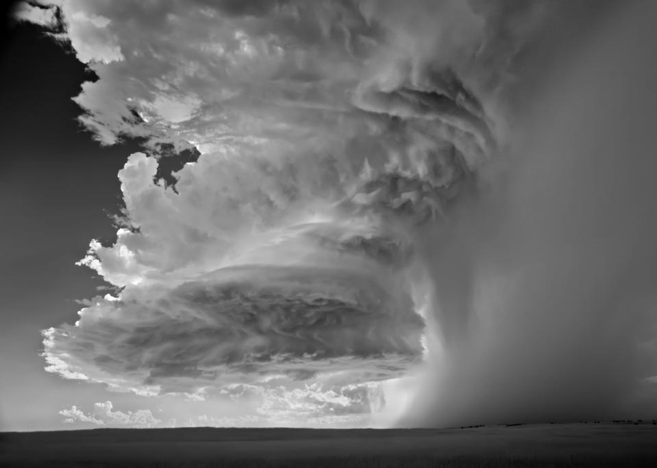 Huge clouds engulf the earth in another of Mitch Dobowner's winning photographs.