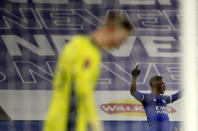 Leicester's Kelechi Iheanacho, right, celebrates after scoring his side's third goal during the English FA Cup quarter final soccer match between Leicester City and Manchester United at the King Power Stadium in Leicester, England, Sunday, March 21, 2021. (AP Photo/Ian Walton, Pool)