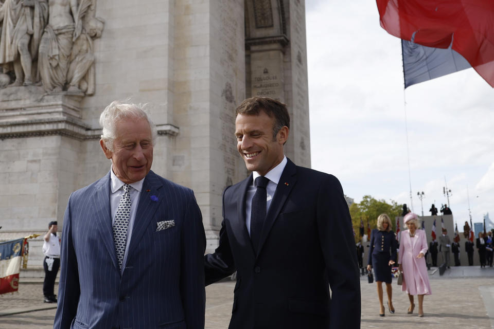 Britain's King Charles III, left, and French President Emmanuel Macron attend a ceremony at the Arc de Triomphe, Wednesday, Sept.20, 2023 in Paris. King Charles III of the United Kingdom starts a three-day state visit to France on Wednesday meant to highlight the friendship between the two nations with great pomp, after the trip was postponed in March amid widespread demonstrations against President Emmanuel Macron's pension changes. (Yoan Valat, Pool via AP)