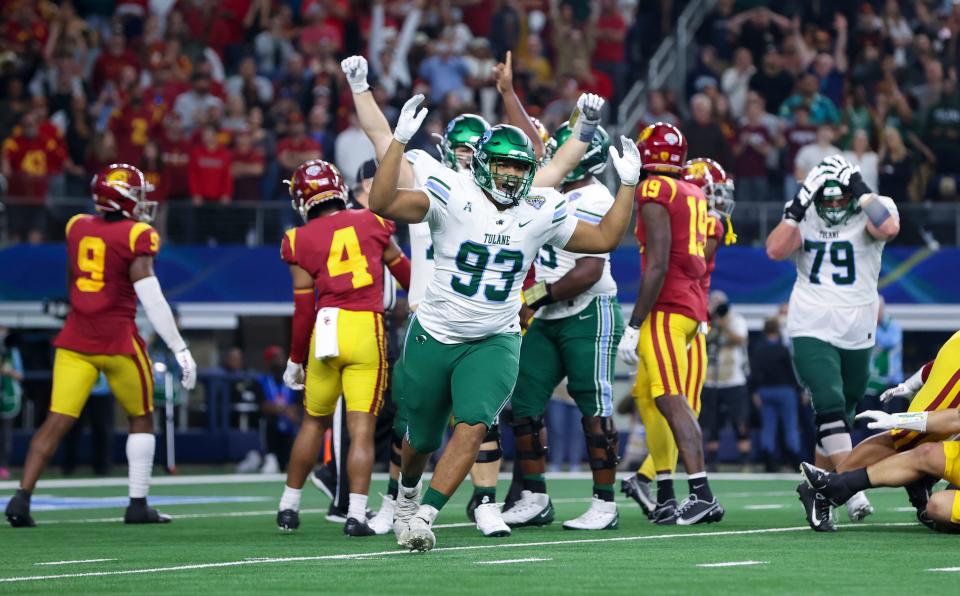 Tulane players celebrates during the fourth quarter of their defeat of Southern California in the 2023 Cotton Bowl at AT&T Stadium.