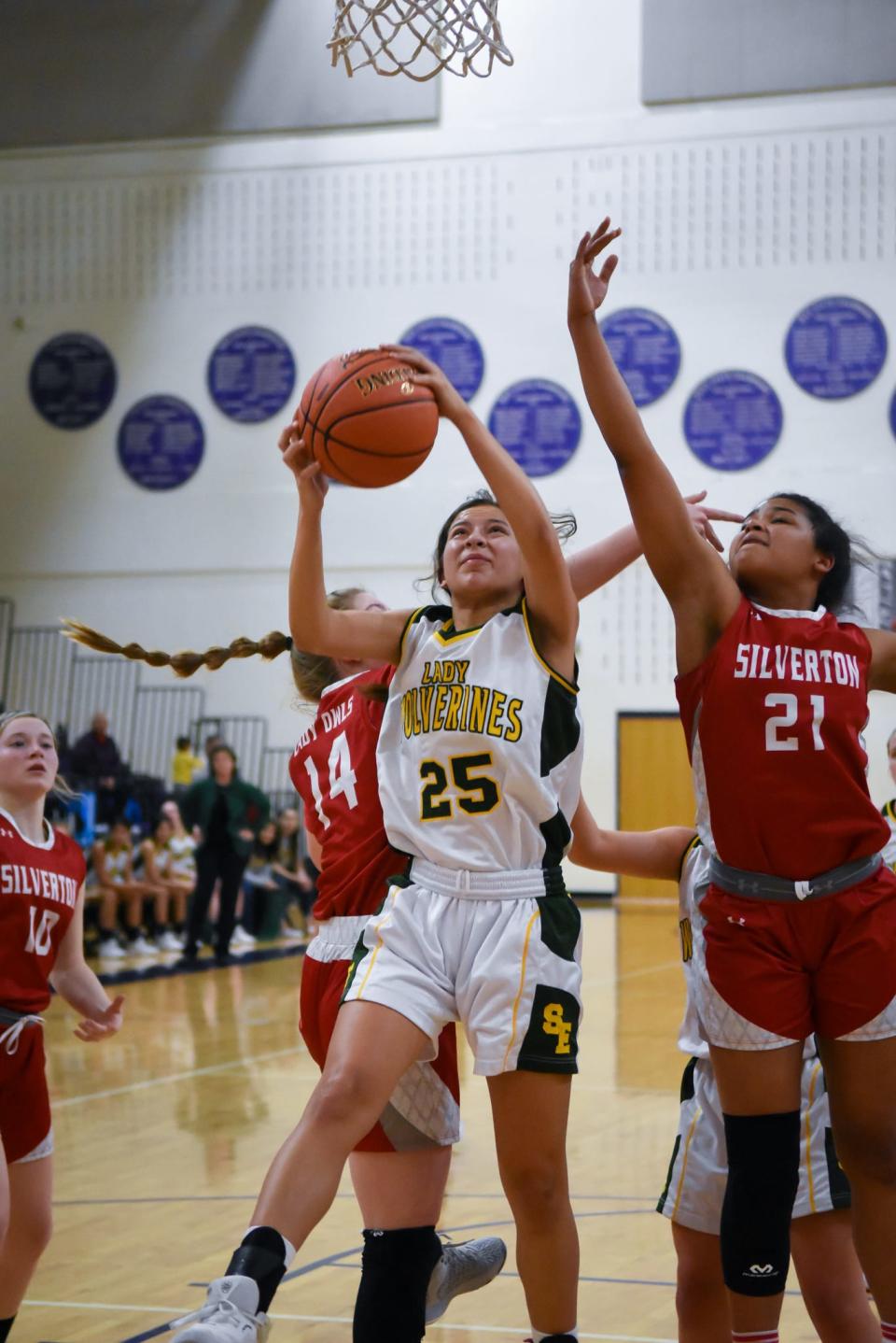 Springlake-Earth's Emma Samaron (25) attempts a layup during Springlake-Earth's 61-44 win over Silverton in a girls' 1A area round on Feb. 18, 2022, at Canyon High School.