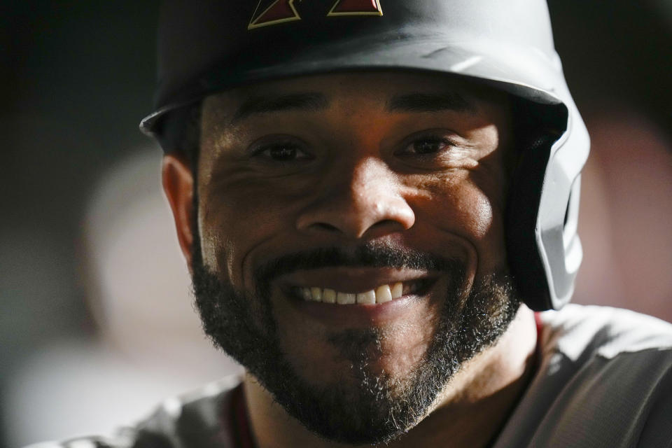 Arizona Diamondbacks' Tommy Pham smiles in the dugout after his two-run home run against the Chicago Cubs during the eighth inning of a baseball game Thursday, Sept. 7, 2023, in Chicago. (AP Photo/Erin Hooley)