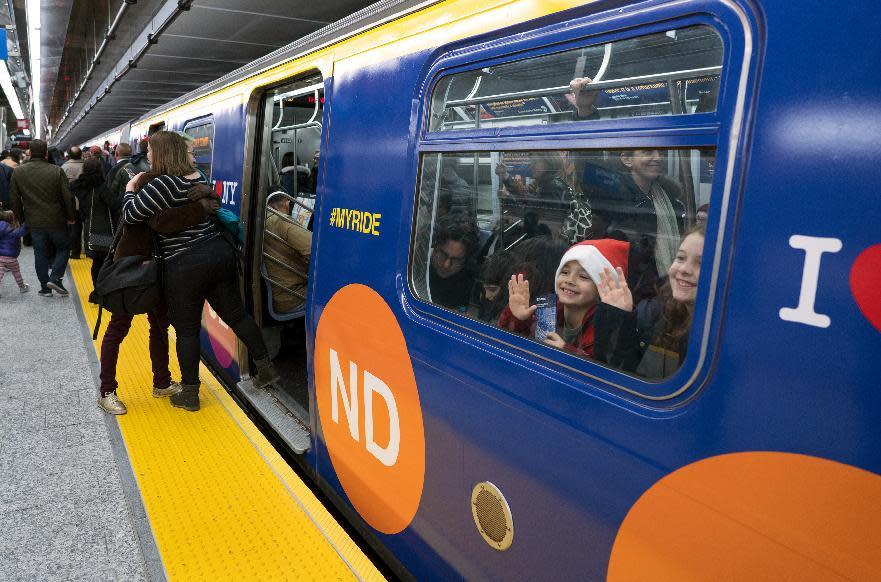 Children peer though a train window at the newly opened 86th Street station on the Second Ave. Subway in New York Sunday, Jan. 1, 2017. The opening of three new stations on the newly opened Second Ave. subway marks a decades long plan to bring rail transportation to Manhattan's Upper East Side. (AP Photo/Craig Ruttle)