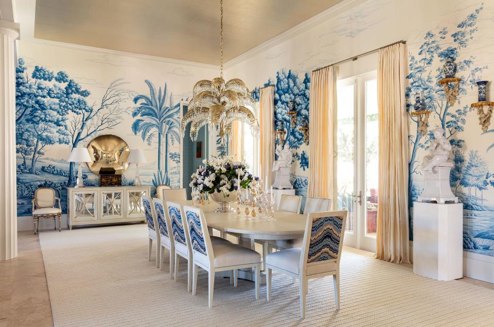 With a tropical outdoor scene, a hand-painted silk wallcovering by de Gournay sets the tone for the dining room, with its soaring ceiling, at the Kips Bay Decorator Show House Palm Beach. The room in the house in West Palm Beach was designed by Tristan Harstan & Co.