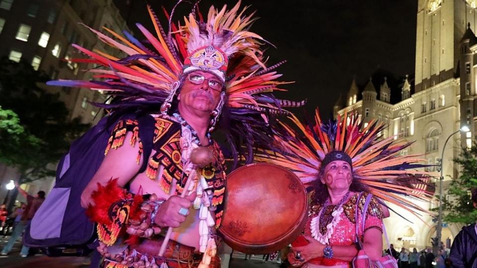 Guillermo Rosette and Linda Velarde join hundreds of other native Americans and their supporters in a traditional round dance at a 2017 protest in front of the Trump International Hotel in Washington, D.C. (Photo by Chip Somodevilla/Getty Images)