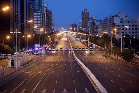 Police cars block Chang'an avenue ahead of the upcoming military parade to mark the 70th anniversary of the end of World War Two, in Beijing, China, September 3, 2015. REUTERS/Aly Song TPX IMAGES OF THE DAY