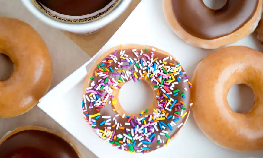 A closeup of assorted doughnuts and coffee