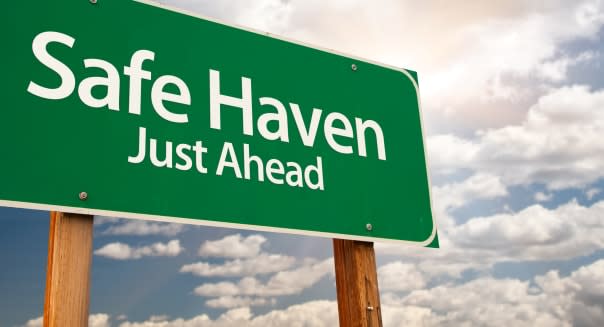 safe haven green road sign with ...