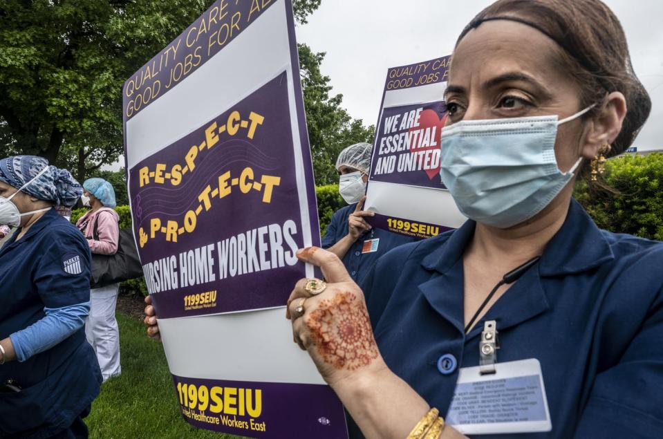 <span class="caption">Nursing home aides have protested working conditions that can push them to work while sick.</span> <span class="attribution"><a class="link " href="https://www.gettyimages.com/detail/news-photo/employees-a-parker-jewish-institute-for-health-care-and-news-photo/1253092062" rel="nofollow noopener" target="_blank" data-ylk="slk:Alejandra Villa Loarca/Newsday via Getty Images;elm:context_link;itc:0;sec:content-canvas">Alejandra Villa Loarca/Newsday via Getty Images</a></span>