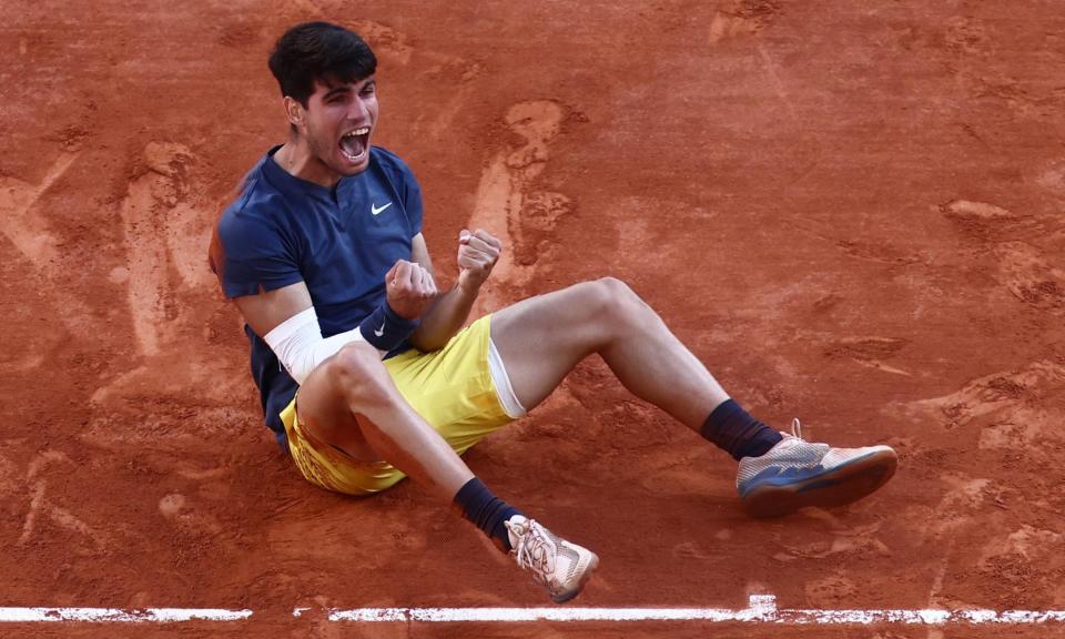 <span>Carlos Alcaraz celebrates beating Alexander Zverev in five sets in the French Open final, with a white sleeve protection for his forearm.</span><span>Photograph: Yves Herman/Reuters</span>