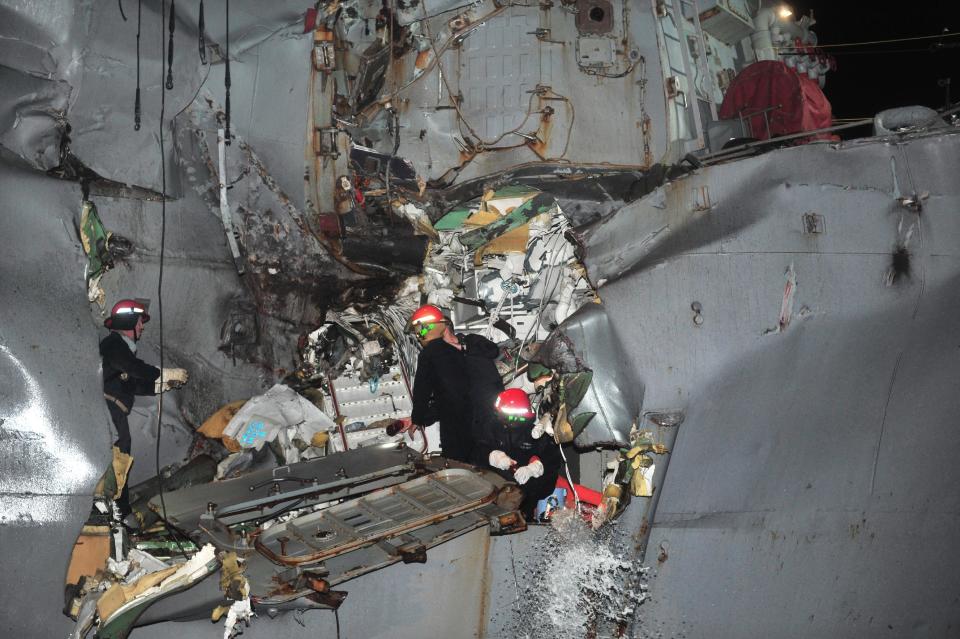 In this image released by the U.S. Navy, the U.S. Navy's guided-missile destroyer is seen damaged after it collided with a Japanese-owned oil tanker just outside the strategic Strait of Hormuz, Sunday, Aug. 12, 2012. The collision left a gaping hole in the starboard side of USS Porter but no one was injured on either vessel, the U.S. Navy said in a statement. (AP Photo/U.S. Navy, Jonathan Sunderman)