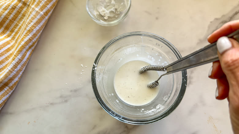 hand whiskingslurry in small bowl