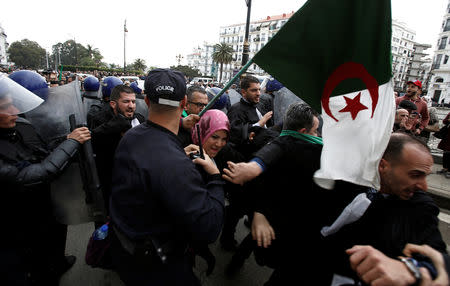 Police try to disperse lawyers marching during a protest to demand the immediate resignation of President Abdelaziz Bouteflika, in Algiers, Algeria March 23, 2019. REUTERS/Ramzi Boudina