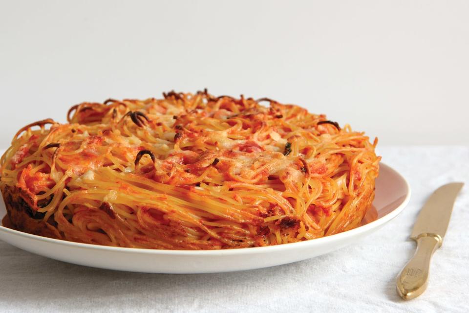 Bake well-sauced pasta—plus plenty of cheese and a few eggs to hold things together—in a cake pan until the edges turn crunchy, crusty, chewy, and downright irresistible. <a href="https://www.epicurious.com/recipes/food/views/spaghetti-pie?mbid=synd_yahoo_rss" rel="nofollow noopener" target="_blank" data-ylk="slk:See recipe." class="link rapid-noclick-resp">See recipe.</a>