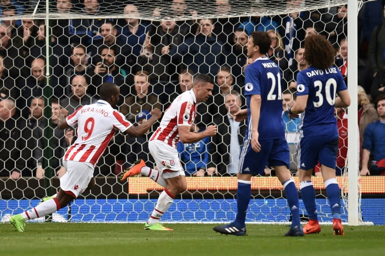 Stoke City's striker Jonathan Walters (C) celebrates after scoring a penalty during the English Premier League football match against Chelsea March 18, 2017