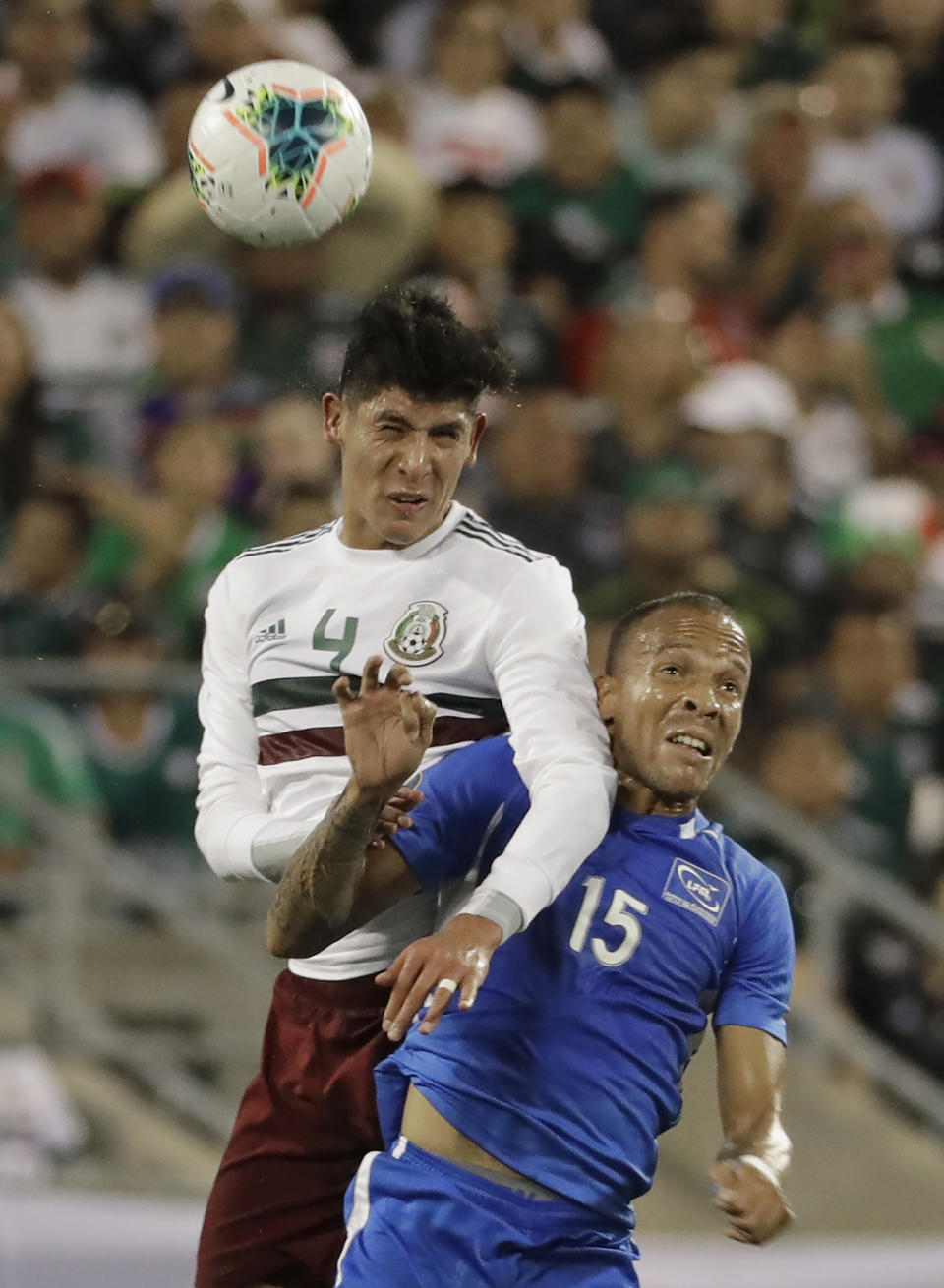 Martinique's Audrick Linord (15) is fouled by Mexico's Edson Alvarez (4) during the first half of their CONCACAF Golf Cup soccer match in Charlotte, N.C., Sunday, June 23, 2019. (AP Photo/Chuck Burton)