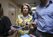 Sen. Shelley Moore Capito, R-W.Va., speaks to reporters as intense negotiations continue to salvage a bipartisan infrastructure deal, at the Capitol in Washington, Tuesday, July 27, 2021. (AP Photo/J. Scott Applewhite)