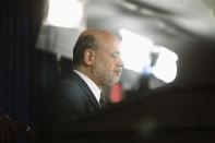 U.S. Federal Reserve Chairman Ben Bernanke responds to reporters during his final planned news conference before his retirement, at the Federal Reserve Bank headquarters in Washington, December 18, 2013. REUTERS/Jonathan Ernst