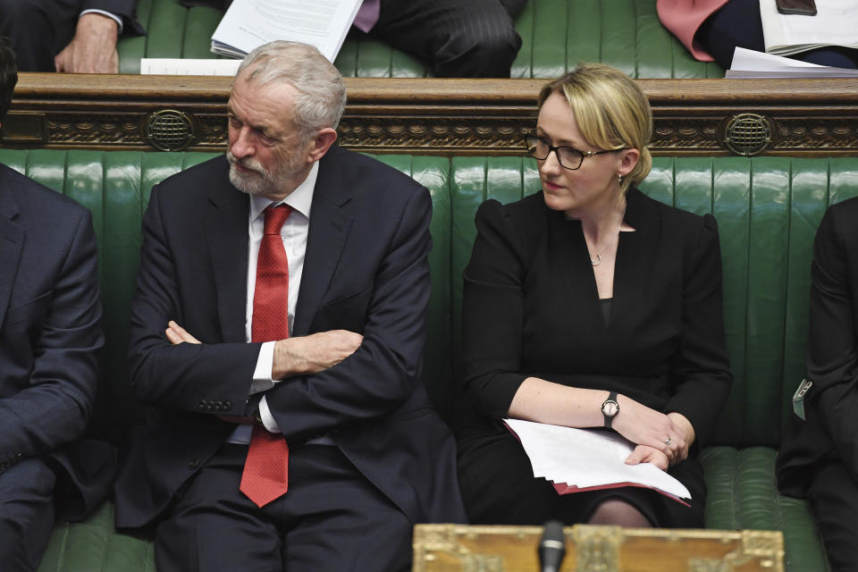 In this photo issued by the UK Parliament, showing Britain's main opposition Labour Party leader Jeremy Corbyn, left, sitting with lawmaker Rebecca Long-Bailey during the traditional parliamentary session Prime Minister's Questions inside the House of Commons in London Wednesday Jan. 15, 2020. Rebecca Long-Bailey is a contender to become leader of the Labour Party. (Jessica Taylor/UK Parliament via AP)