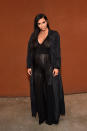 A sheer black jumpsuit? All the better through which to see Kim's growing baby bump, which she showed off at an event in Los Angeles.