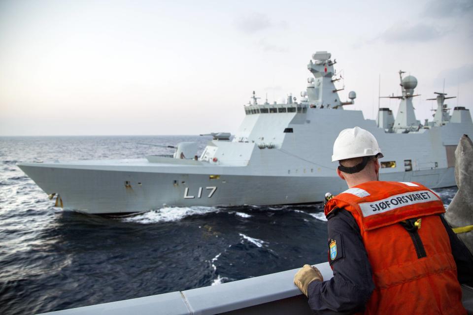 A Norwegian navy officer looks on as Danish support vessel L17 "Esbern Snare" of the Danish-Norwegian task group which will transport Syria's chemical agents for destruction performs training in the Mediterranean Sea, in this handout photo released to Reuters on January 5, 2014 by the Norwegian Armed Forces. REUTERS/Lars Magne Hovtun/Norwegian Armed Forces/Handout via Reuters (CYPRUS - Tags: POLITICS CONFLICT MILITARY) ATTENTION EDITORS - NO SALES. NO ARCHIVES. FOR EDITORIAL USE ONLY. NOT FOR SALE FOR MARKETING OR ADVERTISING CAMPAIGNS. THIS IMAGE HAS BEEN SUPPLIED BY A THIRD PARTY. IT IS DISTRIBUTED, EXACTLY AS RECEIVED BY REUTERS, AS A SERVICE TO CLIENTS