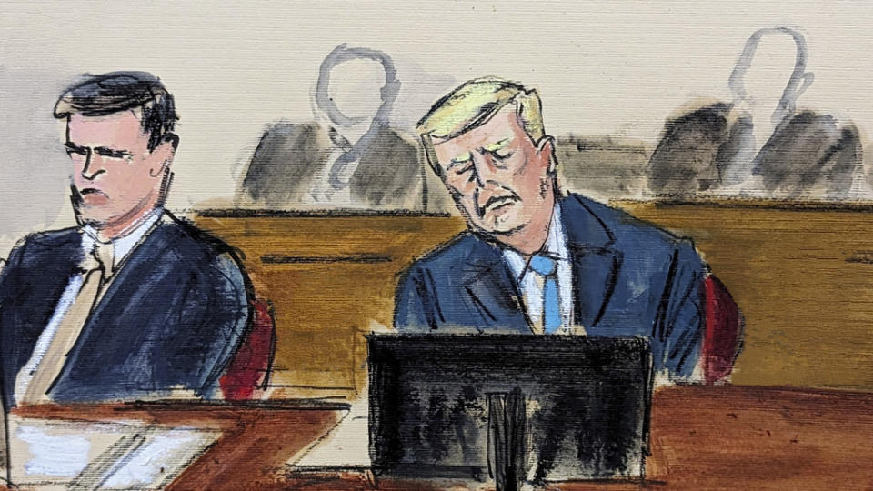 Donald Trump, right, sits at defense table during Judge Merchan’s reading of his ruling and instructions to the jury in Manhattan criminal court Monday, April 22, 2024, in New York. (Elizabeth Williams via AP)