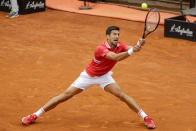 Serbia's Novak Djokovic returns the ball to Spain's Rafael Nadal during their final match at the Italian Open tennis tournament, in Rome, Sunday, May 16, 2021. (AP Photo/Gregorio Borgia)