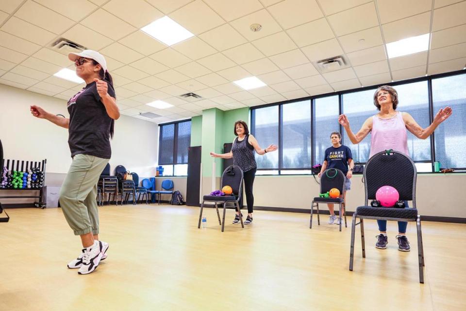 Exercise instructor Silvana Underwood leads Mitzi Gault, Tracey Hawn, and Patti Crummel in a cardio exercise as part of their exercise program at the Texas Health Southwest Fitness Center.