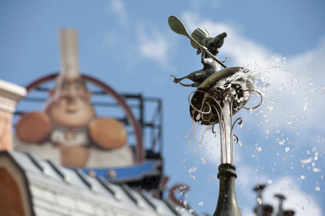 ratatouille inspired fountain features rats holding bottles and flutes of champagne as water shoots out of the bottles toward the top basin in the newly expanded france pavilion at epcot at walt disney world resort in lake buena vista, fla chef remy stands atop the fountain wearing his classic french toque hat and holding a cooking spoon harrison cooney, photographer