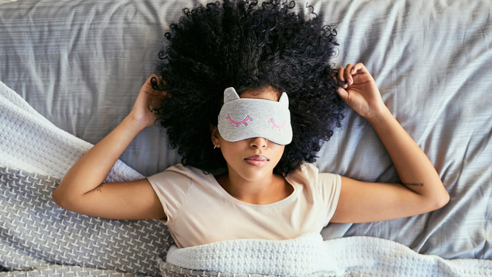 Woman sleeps with sleep mask