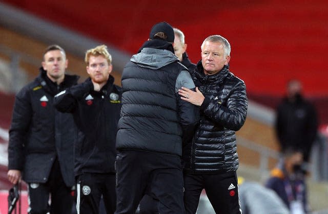 Jurgen Klopp and Chris Wilder embrace on the touchline