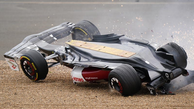 Alfa Romeo's Zhou Guanyu slides towards the barrier after a collision at the start of the race during the British Grand Prix 2022 at Silverstone, Towcester.