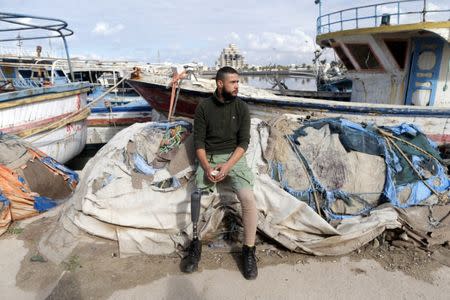 Mutassim al-Misrati, a Benghazi-local who lost his leg during a three-year war in the city, looks on as he sits at Benghazi port, Libya December 27, 2017. Picture taken December 27, 2017. REUTERS/Esam Omran Al-Fetori
