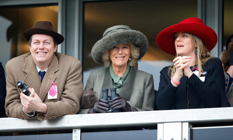 Camilla, Duchess of Cornwall (centre) her son Tom Parker Bowles (left) and daughter Laura Lopes (right) watch the racing as they attend day 2 of the Cheltenham Festival at Cheltenham Racecourse on March 11, 2015 in Cheltenham, England. (Photo by Max Mumby/Indigo/Getty Images)