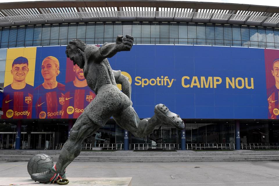 This photograph taken on July 1, 2022 shows the logo of Spotify Technology S.A on the banner at the entrance of the Camp Nou stadium in Barcelona. (Photo by Pau BARRENA / AFP) (Photo by PAU BARRENA/AFP via Getty Images)