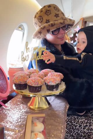 <p>Paris Hilton/Instagram</p> Paris Hilton and her son Phoenix on a decorated private jet during a trip to celebrate her 43rd birthday