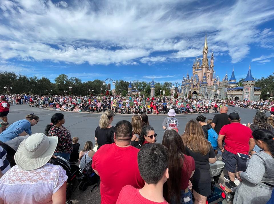 people lining up for a parade in magic kingdom at disney world