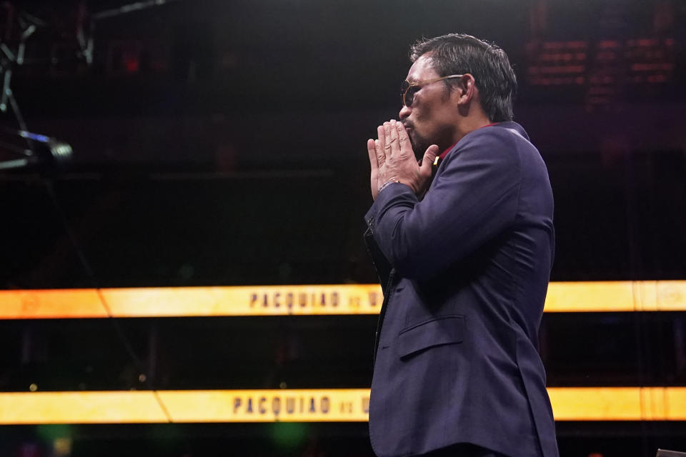 Manny Pacquiao, of the Philippines, reacts after a news conference after his loss to Yordenis Ugas, of Cuba, in a welterweight championship boxing match Saturday, Aug. 21, 2021, in Las Vegas. (AP Photo/John Locher)