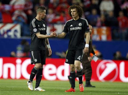 Chelsea's Fernando Torres (L) and David Luiz shake hands after their Champions League semi-final first leg soccer match against Atletico Madrid at Vicente Calderon stadium in Madrid April 22, 2014. The match ended 0-0. REUTERS/Sergio Perez