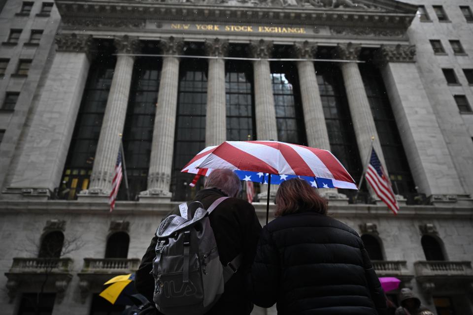 ftse People walk past the New York Stock Exchange (NYSE) on March 28, 2024 in New York City.