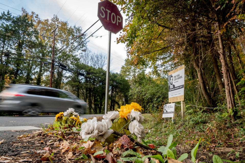 Flowers and signs mark at the spot where Bijan Ghaisar was allegedly killed by U.S. Park Police officers during a traffic stop at Alexandria Ave. and Ft. Hunt Road in Alexandria, Va. (Photo: Mary F. Calvert for Yahoo News)