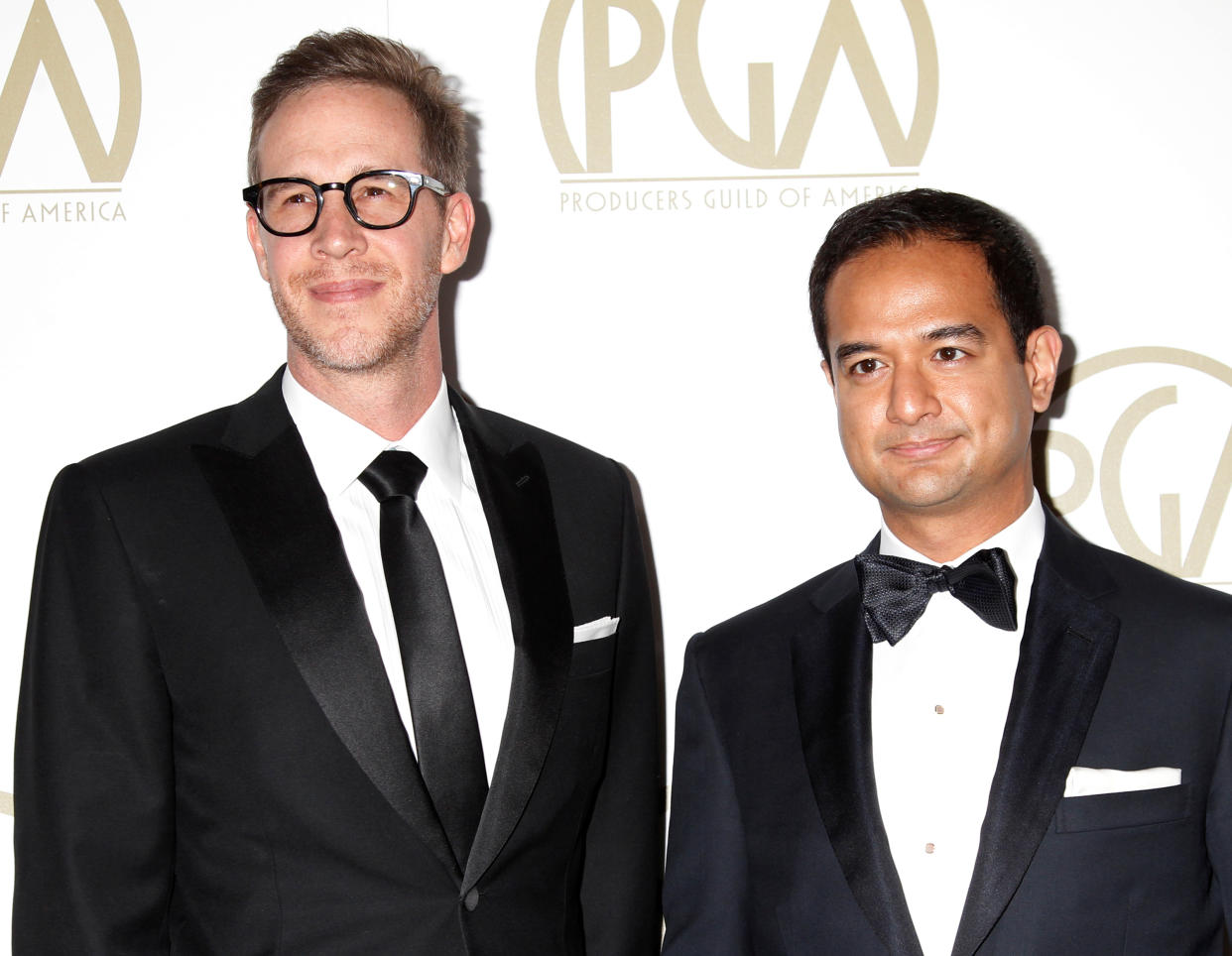 Riza Aziz stands with Joey McFarland, another producer of the film ‘The Wolf of Wall Street’, as they arrive at the 25th Annual Producers Guild of America Awards in Los Angeles January 19, 2014. — Reuters pic