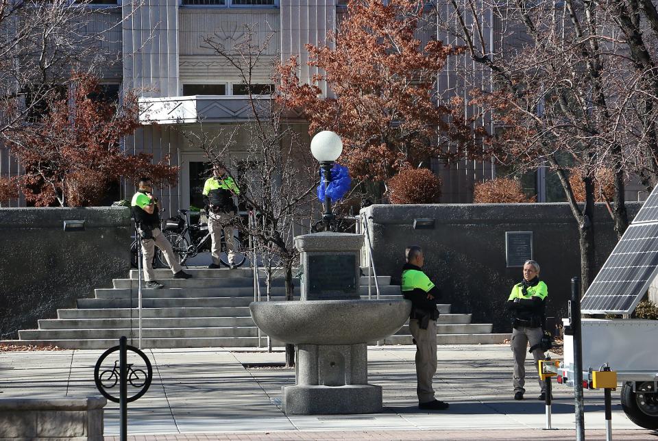 Carson Sheriff's officers stand in front of the Office of the Attorney General in Carson City, Nev., on Sunday, Jan. 17, 2021.