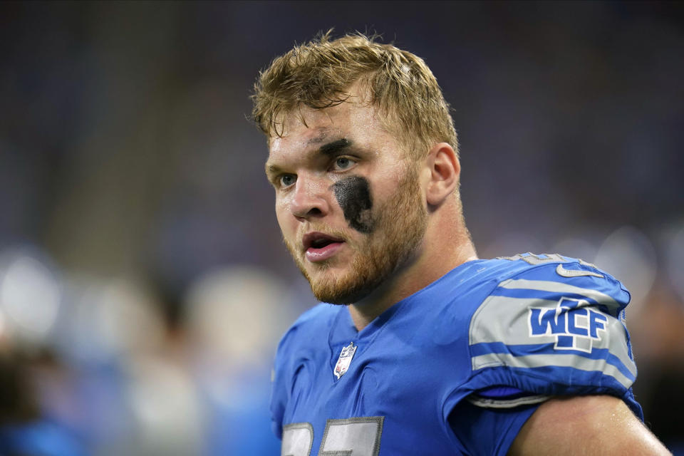 Detroit Lions defensive end Aidan Hutchinson (97) watches from the sideline during the first half of an NFL football game against the Washington Commanders Sunday, Sept. 18, 2022, in Detroit. (AP Photo/Paul Sancya)